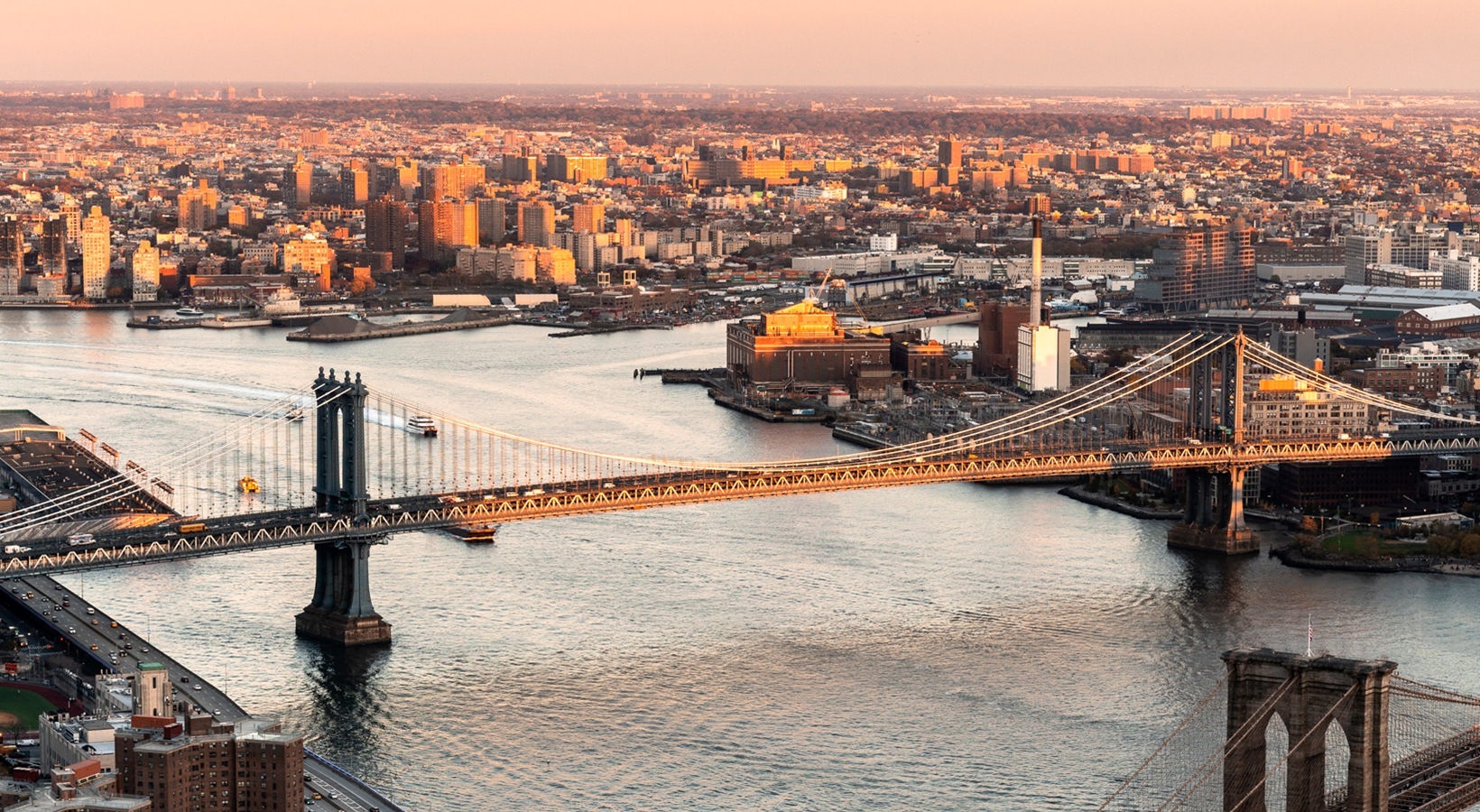 Aerial sunset view of the Manhattan Bridge spanning the East River from 19 Dutch.