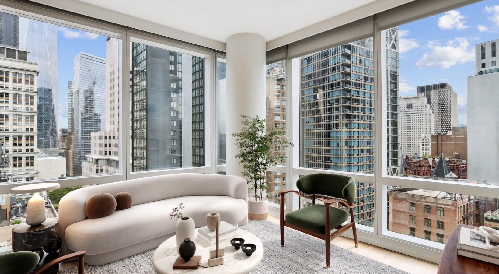 Corner living room at 19 Dutch with floor-to-ceiling windows overlooking the Lower Manhattan skyline.