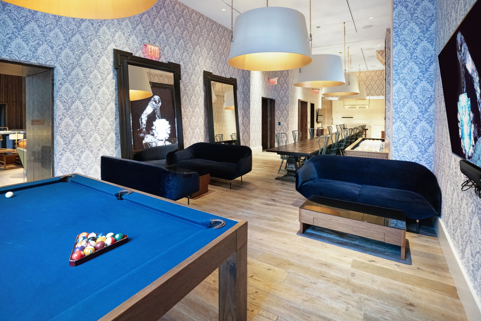 Event lounge at 19 Dutch with a billiards table, modern seating, and a long communal dining table in Lower Manhattan