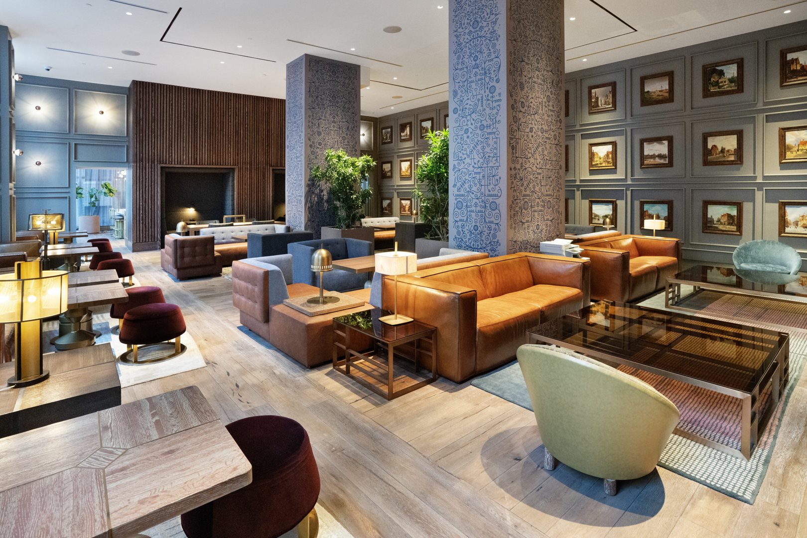 Great Room at 19 Dutch with leather seating, art-filled walls, and modern décor in FiDi, Lower Manhattan.