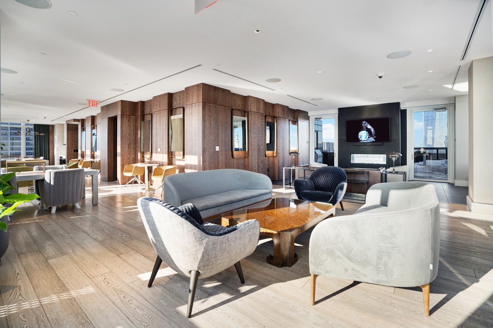 Penthouse Sky lounge at 19 Dutch with modern seating, wood accents, and skyline views in Lower Manhattan.