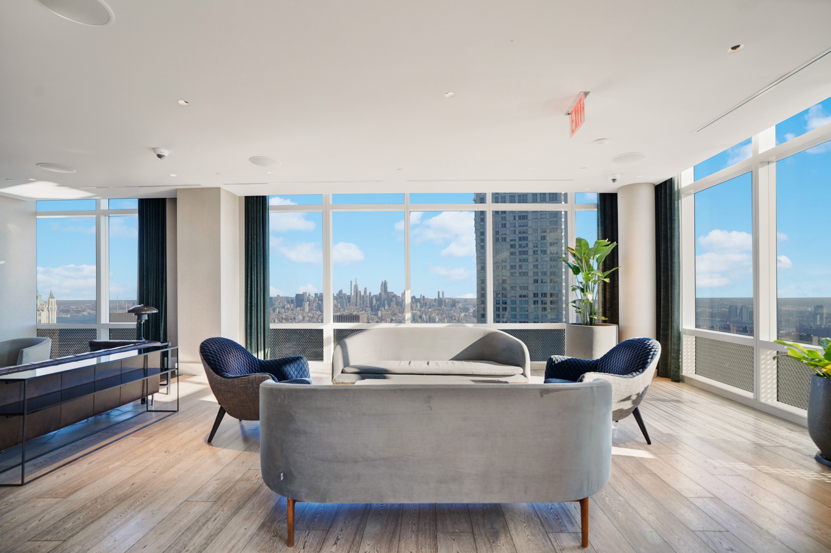 Rooftop coworking lounge with modern sofa and leather seating at 19 Dutch in Lower Manhattan.