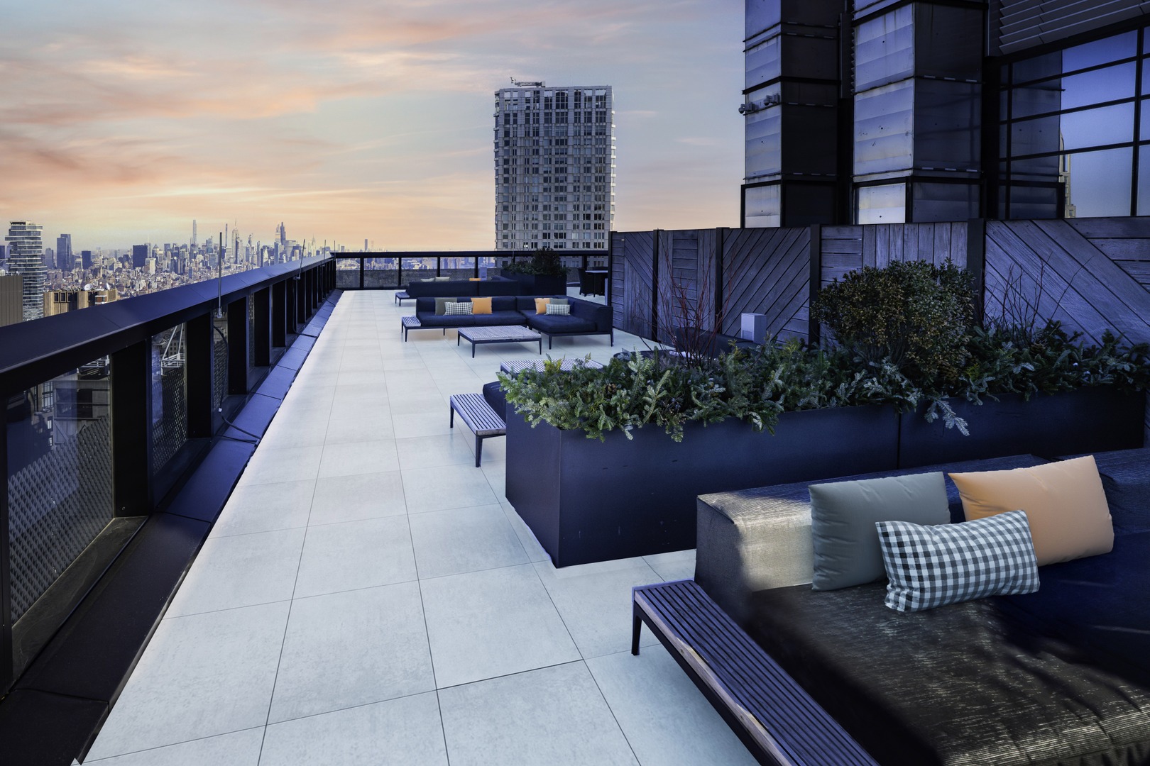 Rooftop terrace at 19 Dutch with outdoor sofa seatings and panoramic views of Lower Manhattan.
